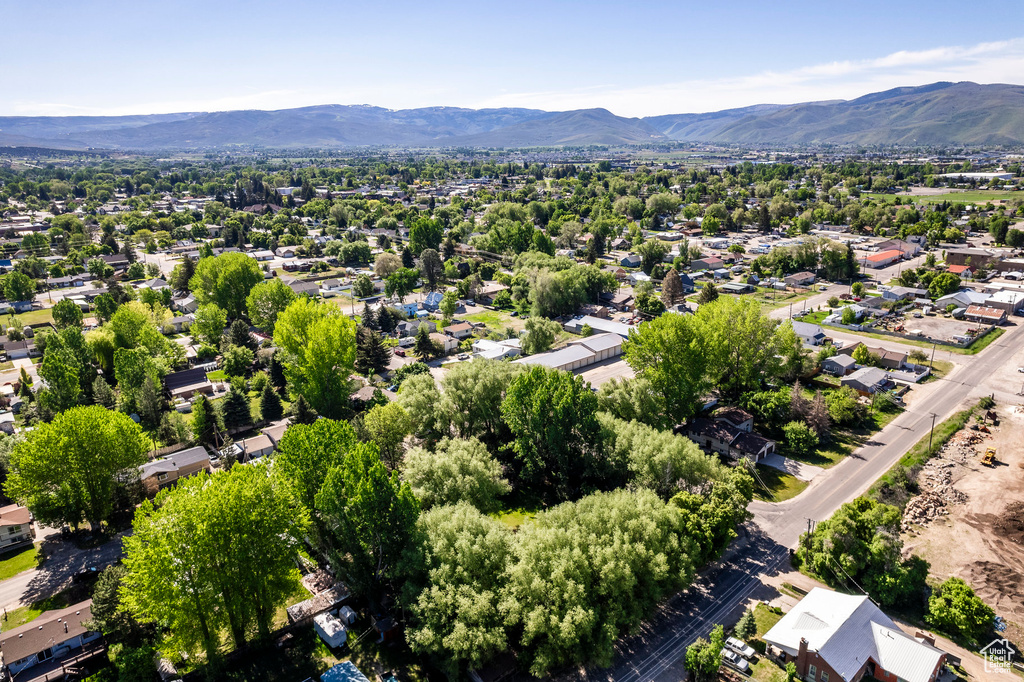 Birds eye view of property with a mountain view