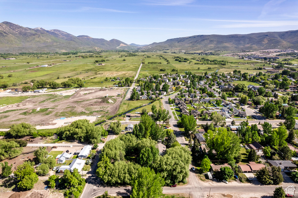 Birds eye view of property with a mountain view