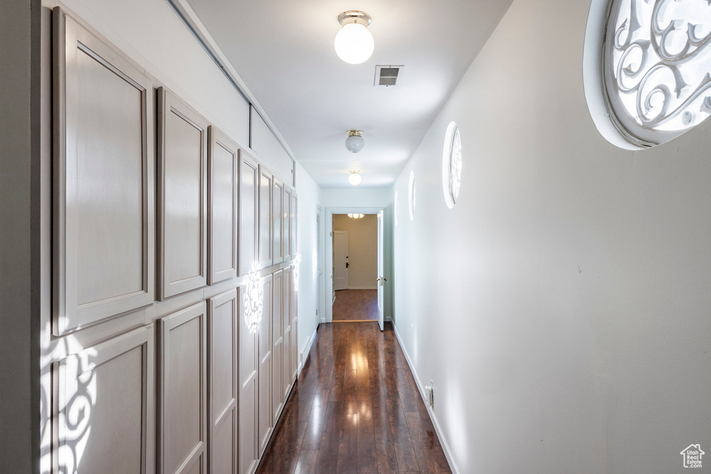 Corridor with dark hardwood / wood-style floors