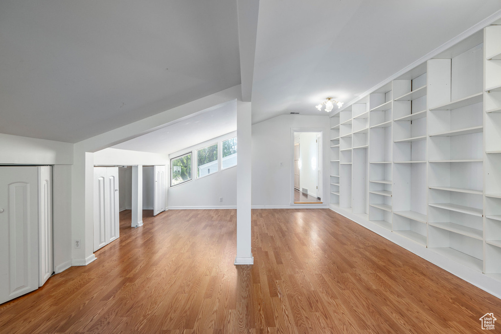 Interior space with light hardwood / wood-style flooring and lofted ceiling