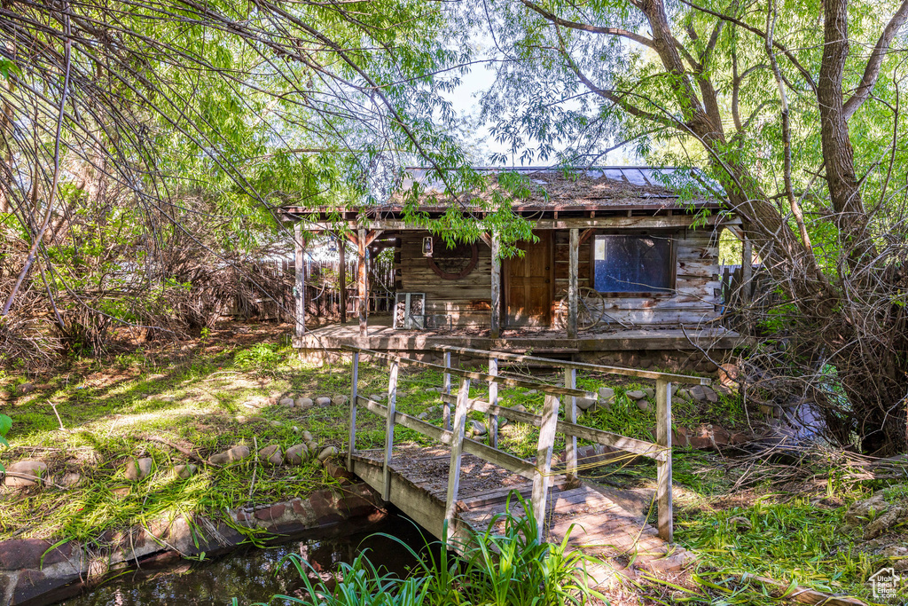 Rear view of house with a water view