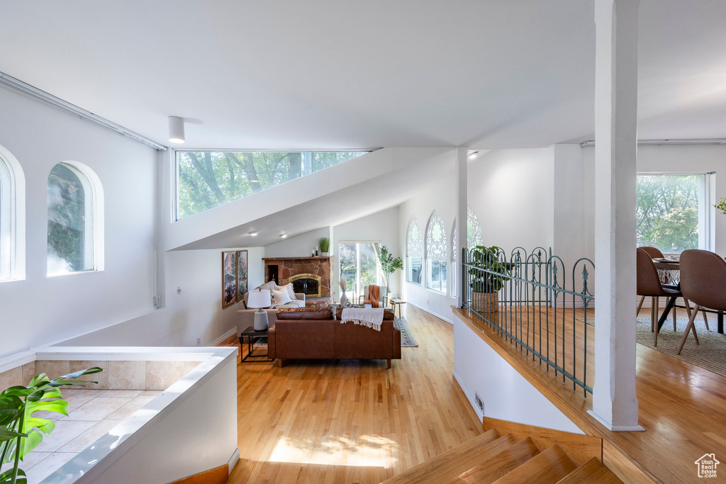 Living room with plenty of natural light and light hardwood / wood-style flooring