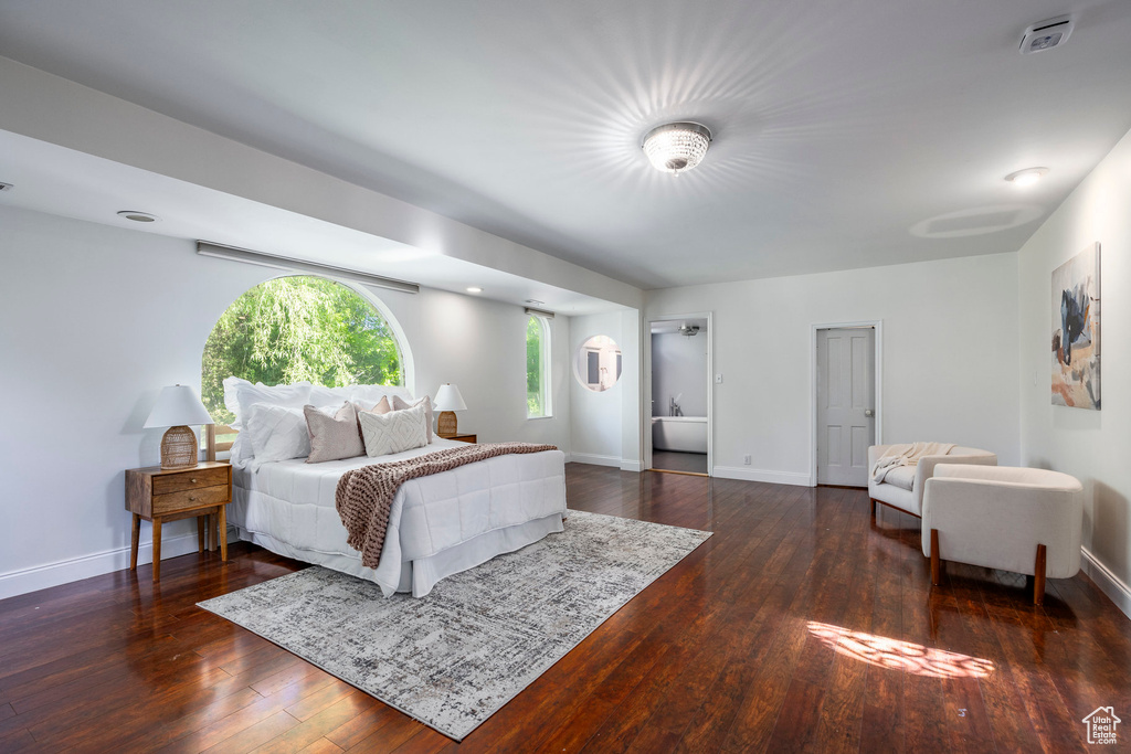 Bedroom featuring dark hardwood / wood-style flooring