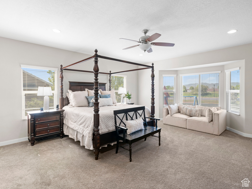 Bedroom with carpet and ceiling fan