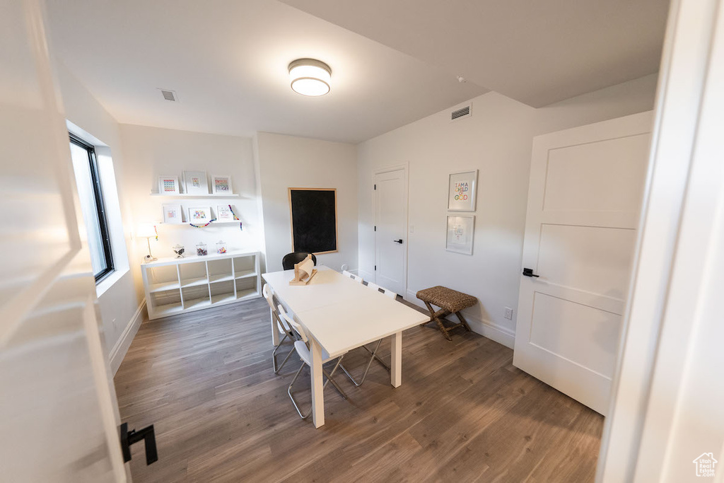 Dining space with wood-type flooring