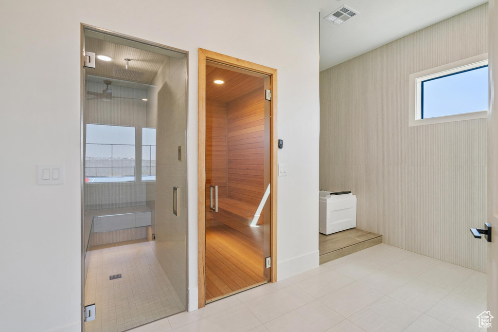 Bathroom with tile patterned flooring and walk in shower