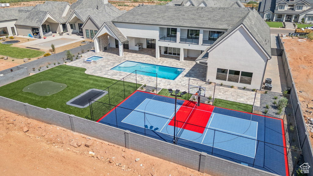 View of swimming pool with a lawn and a patio