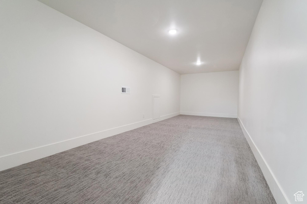 Unfurnished room with carpet