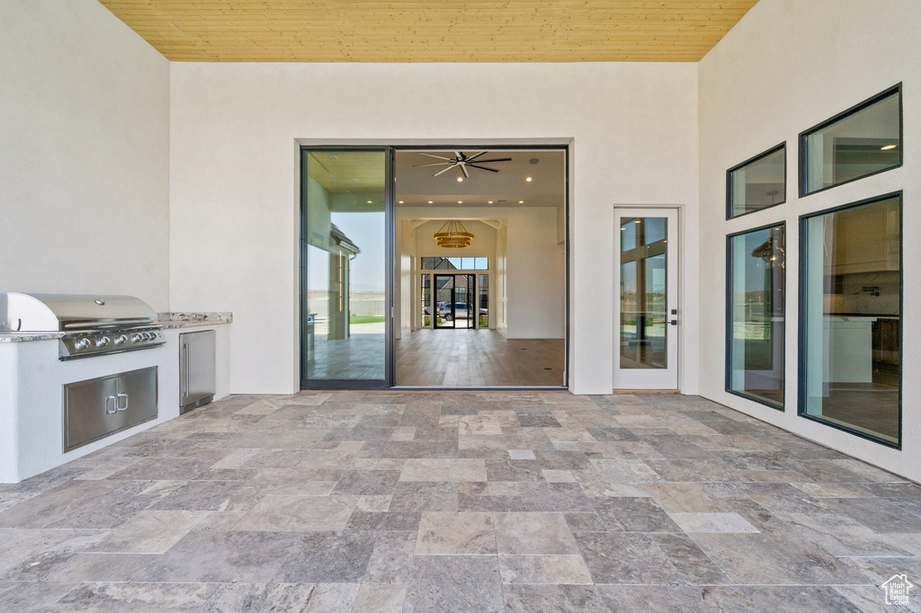 View of patio / terrace with a grill, an outdoor kitchen, and french doors