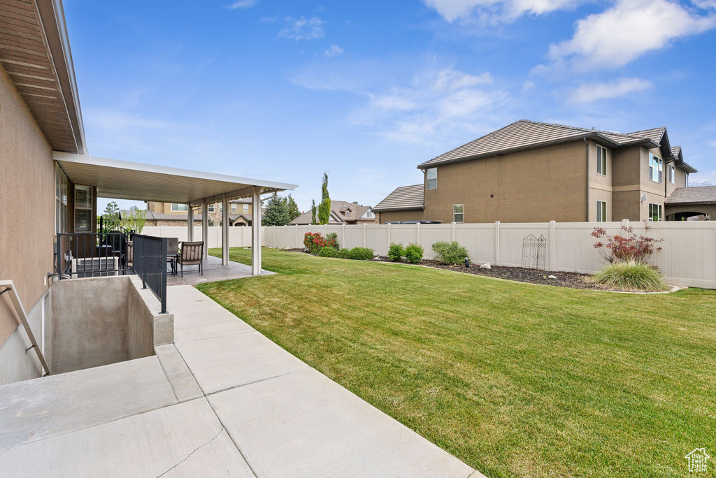 View of yard with a patio area