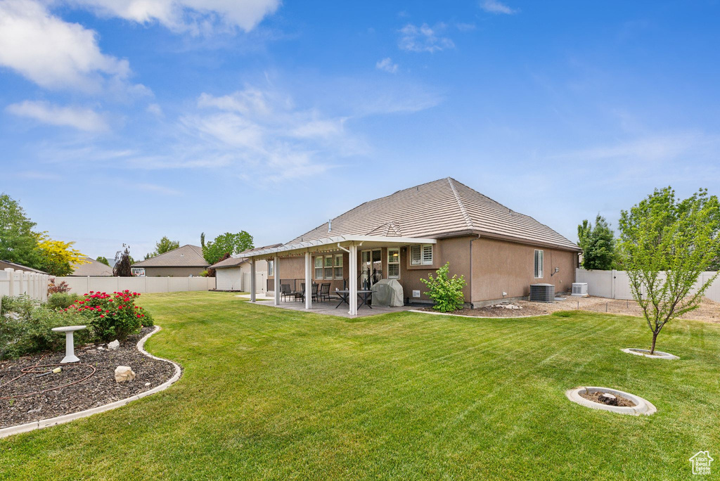 Exterior space with a patio and central AC