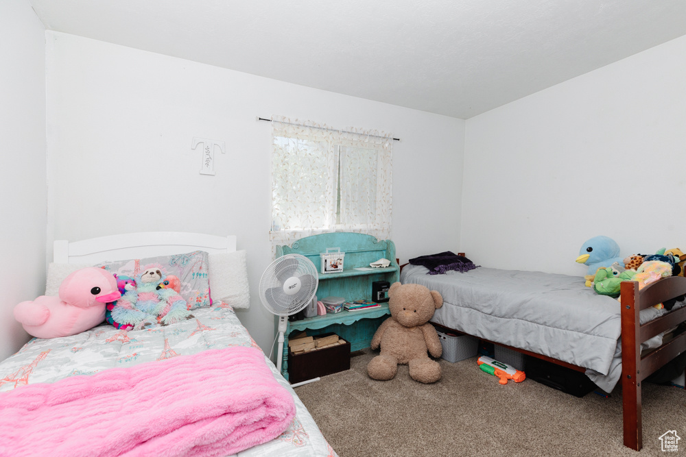 Bedroom featuring carpet floors