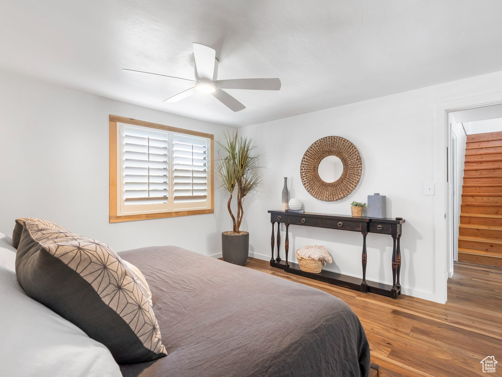 Bedroom with wood-type flooring and ceiling fan