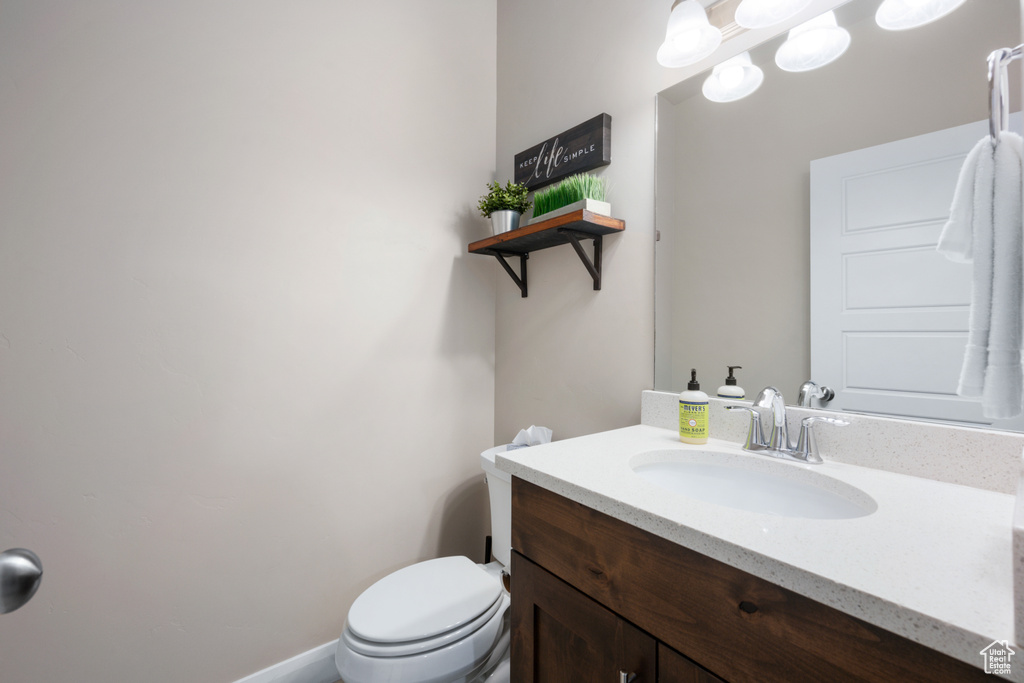 Bathroom with toilet and large vanity