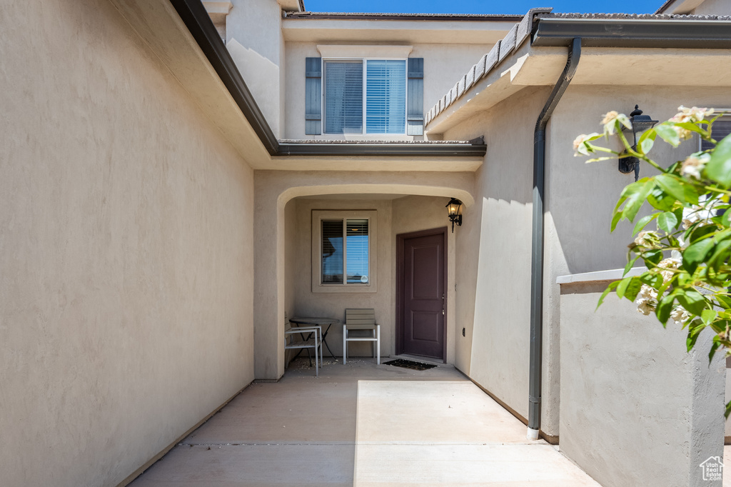 Property entrance with a patio area