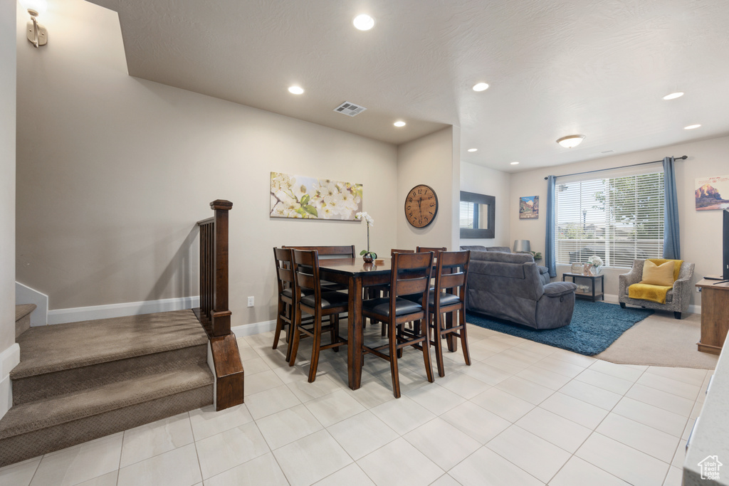 Dining area featuring light tile flooring