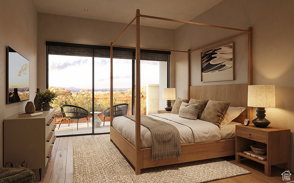 Bedroom with access to exterior and hardwood / wood-style floors