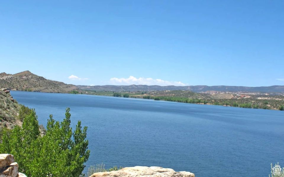 View of water feature with a mountain view