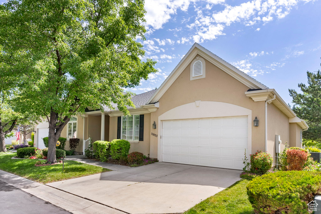 Single story home featuring a garage