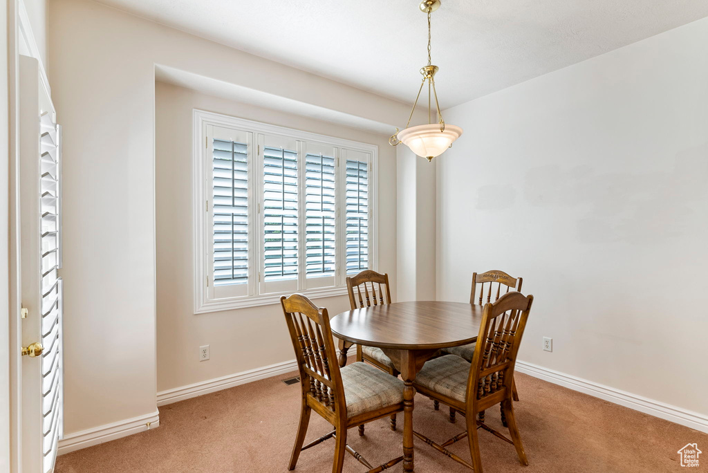 View of carpeted dining room