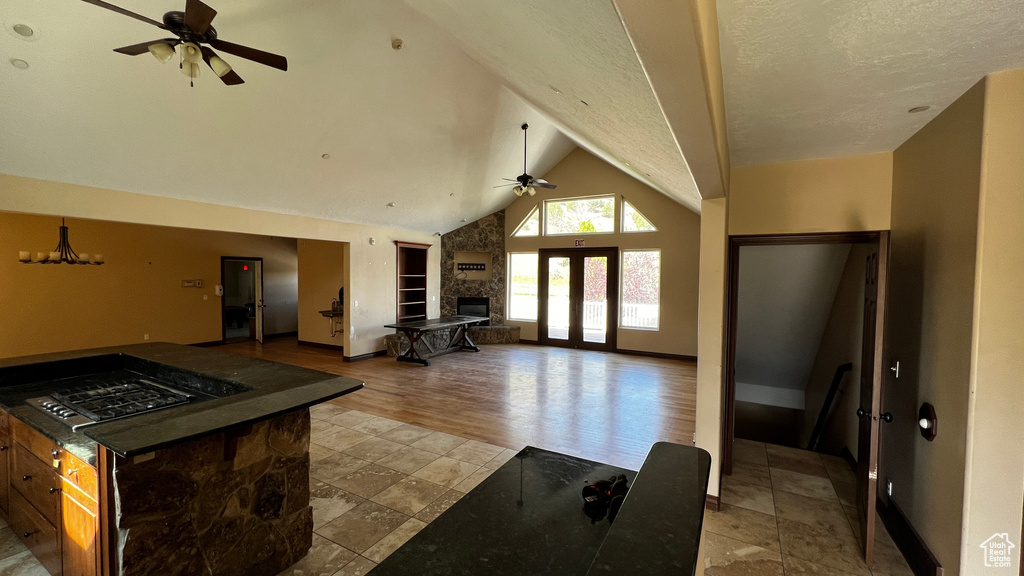 Kitchen featuring light tile floors, ceiling fan, and a textured ceiling