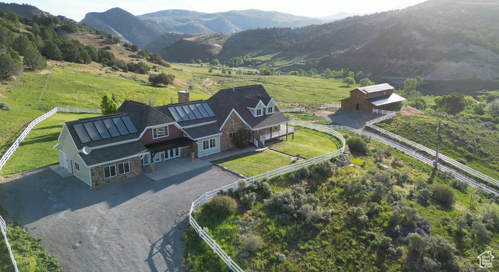 Birds eye view of property with a mountain view