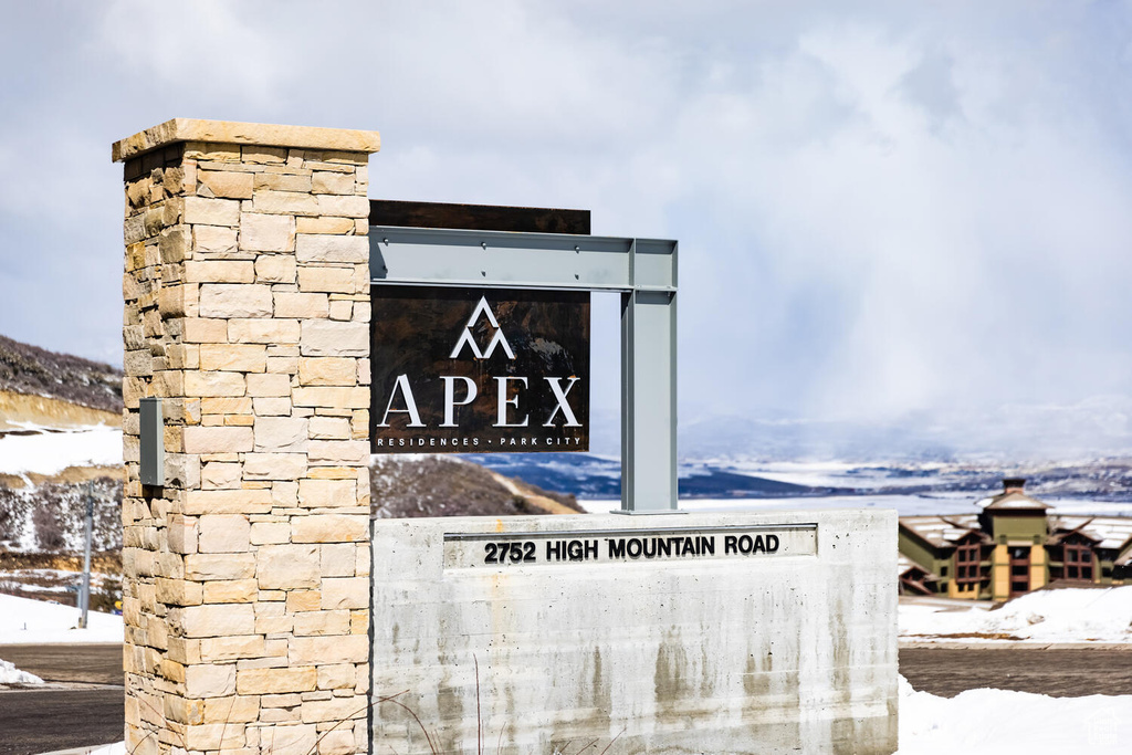 Community sign featuring a mountain view