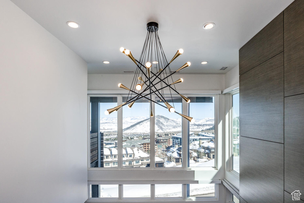 Interior details featuring a mountain view and a chandelier