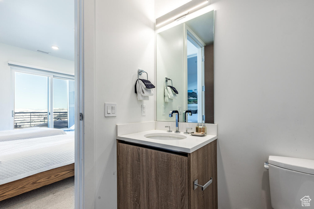 Bathroom with vanity and toilet