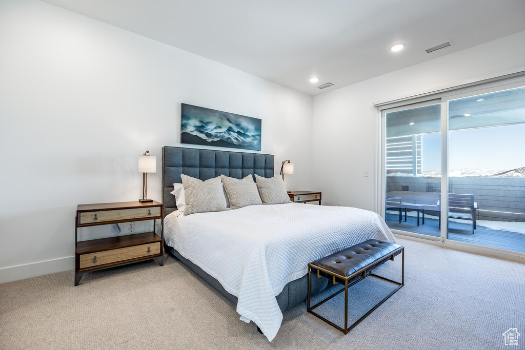 Bedroom featuring access to outside and light carpet