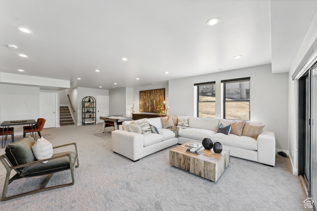 Living room featuring light carpet