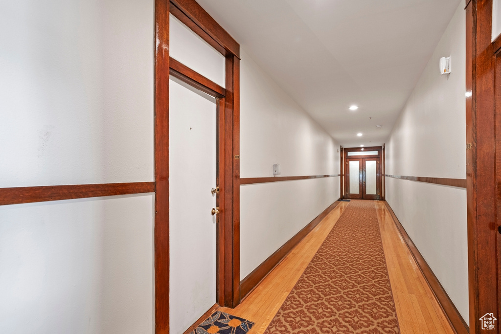 Hall featuring light hardwood / wood-style flooring