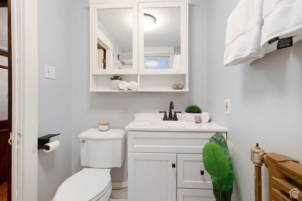 Bathroom with toilet and vanity