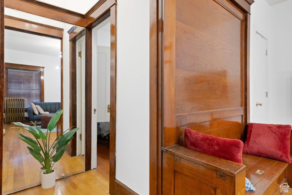 Hallway with light hardwood / wood-style floors