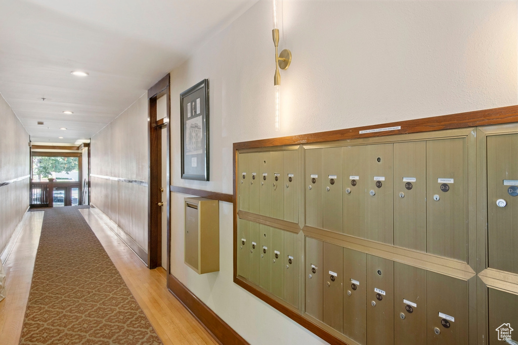 Interior space with a mail area and light hardwood / wood-style flooring