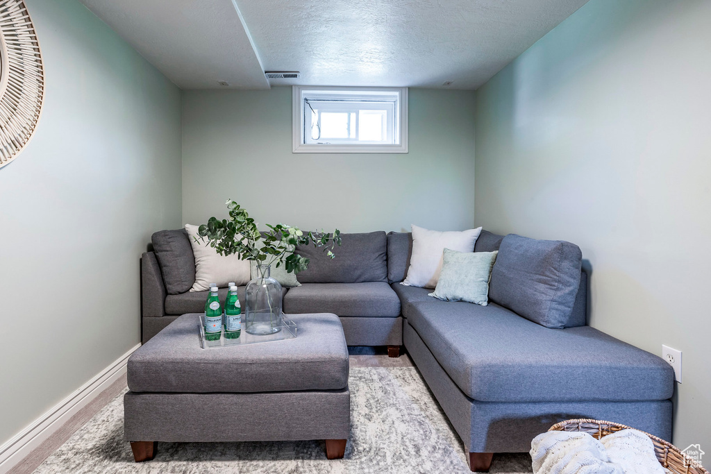 Living room with light hardwood / wood-style flooring