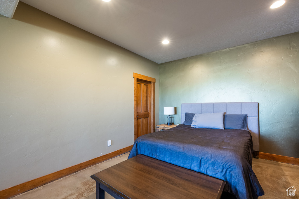 Bedroom with concrete floors