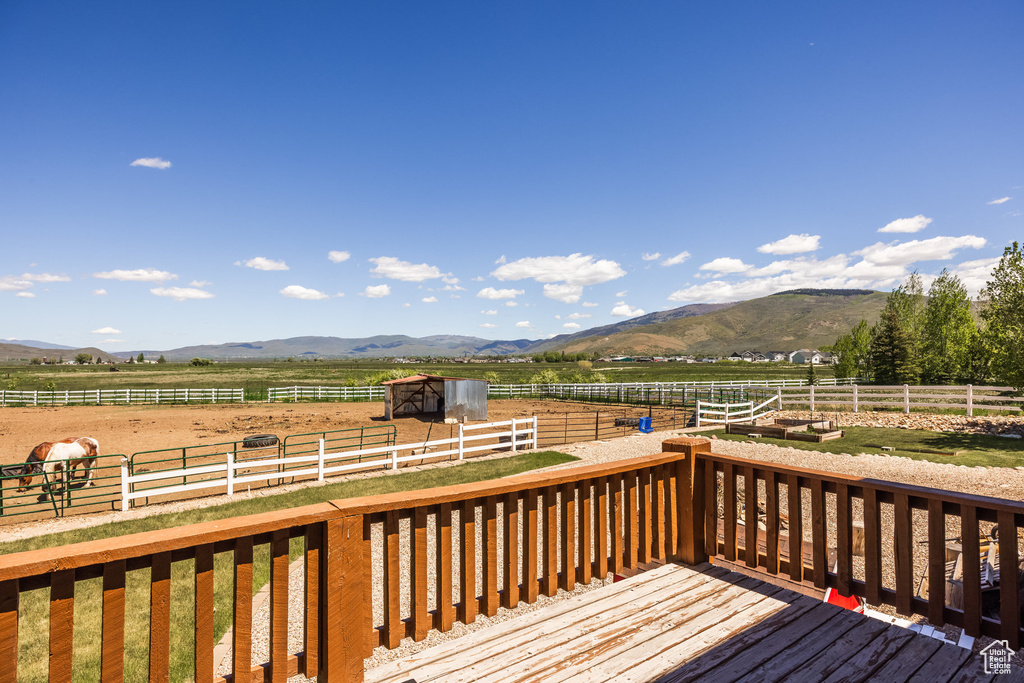 Deck featuring a mountain view and a rural view