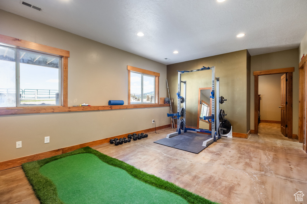 Workout room with a textured ceiling