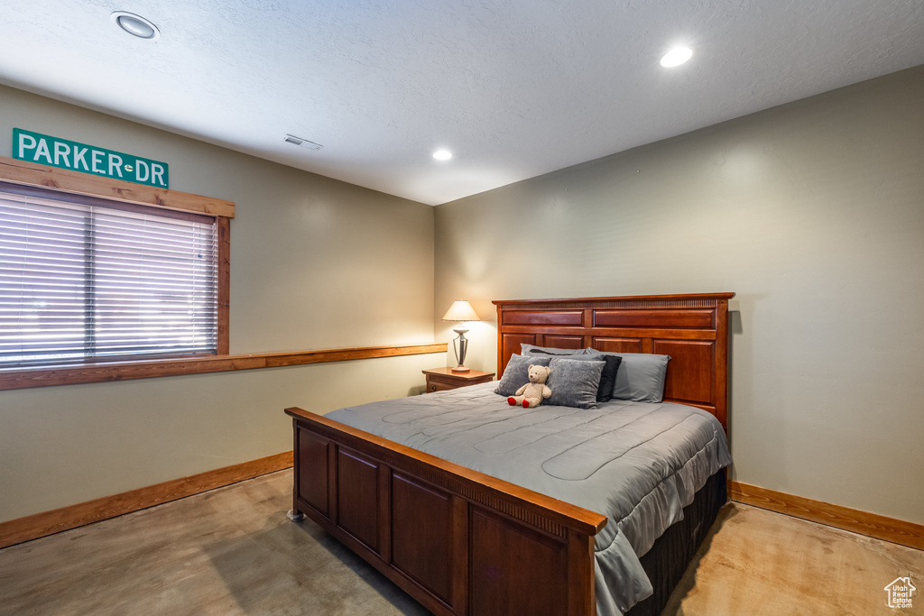 Bedroom with a textured ceiling