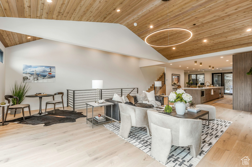 Interior space with recessed lighting, stairway, light wood-style flooring, high vaulted ceiling, and wood ceiling