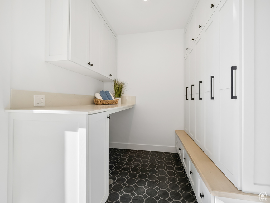 Mudroom featuring dark tile patterned flooring