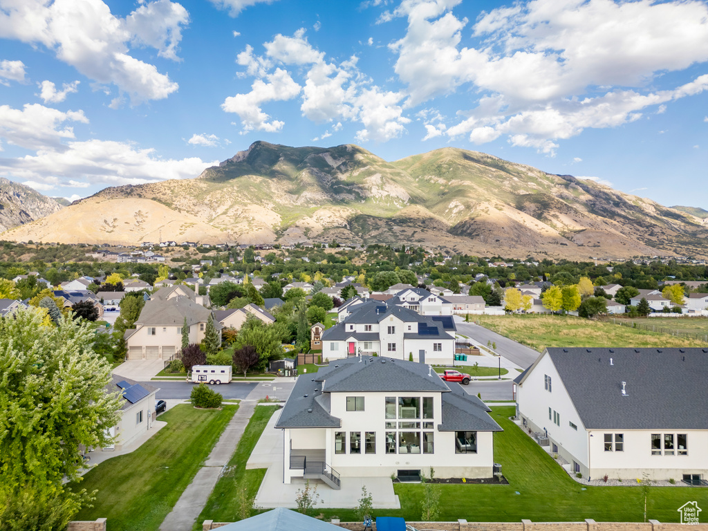 Birds eye view of property with a mountain view