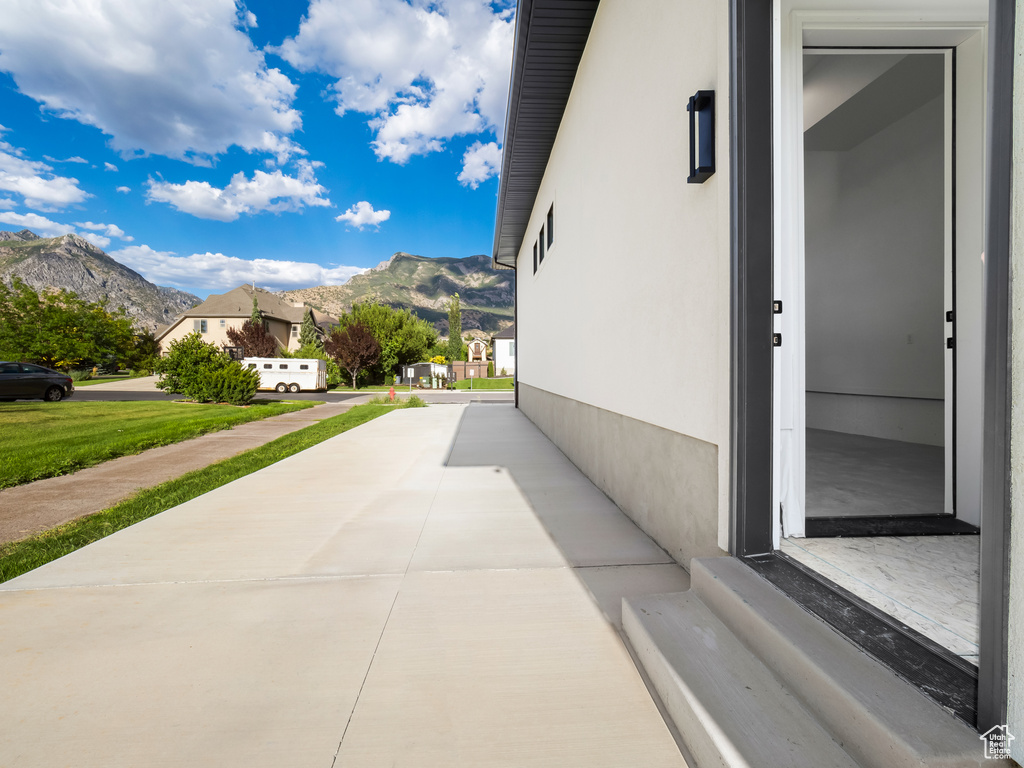 View of side of home featuring a mountain view