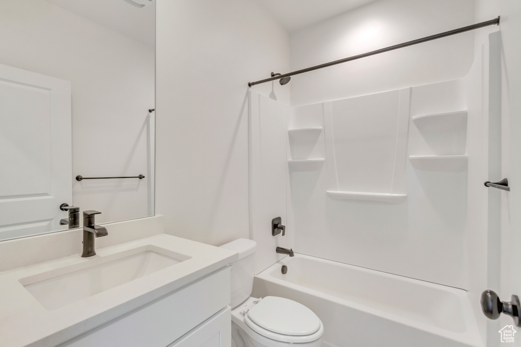 Full bathroom with vanity, toilet, and shower / bathtub combination