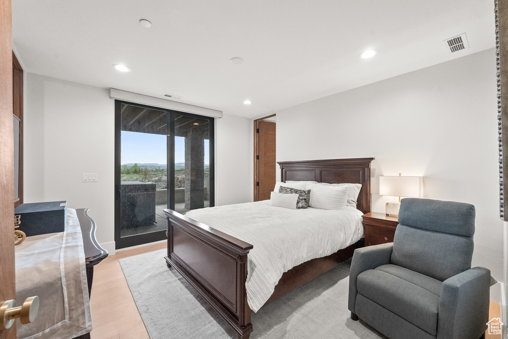 Bedroom featuring light hardwood / wood-style floors and access to exterior