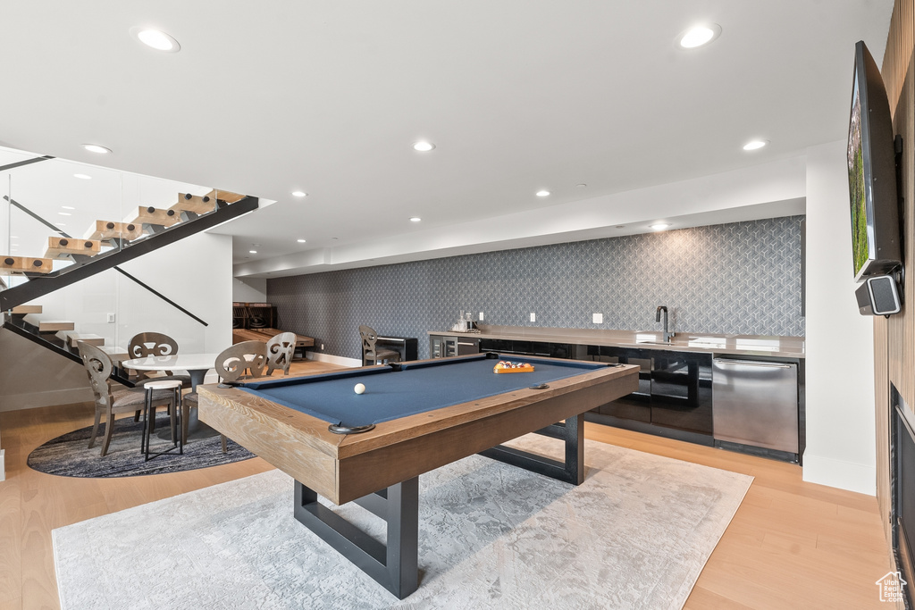 Rec room with pool table and light hardwood / wood-style floors