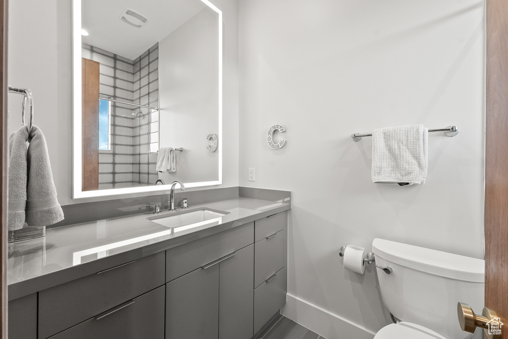 Bathroom with vanity and toilet