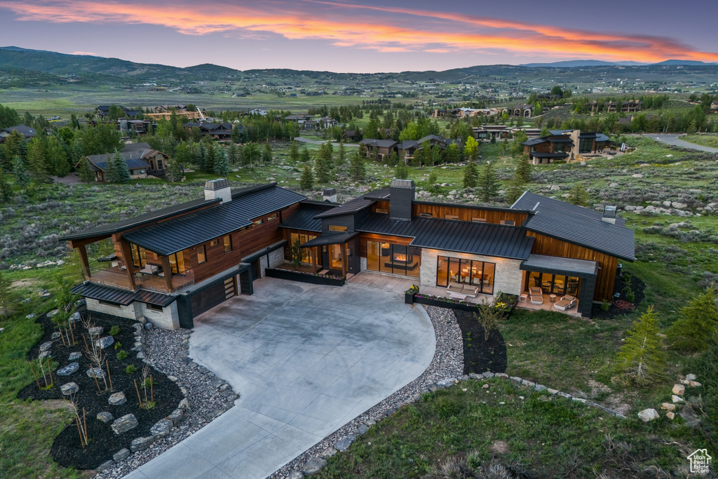 Aerial view at dusk featuring a mountain view