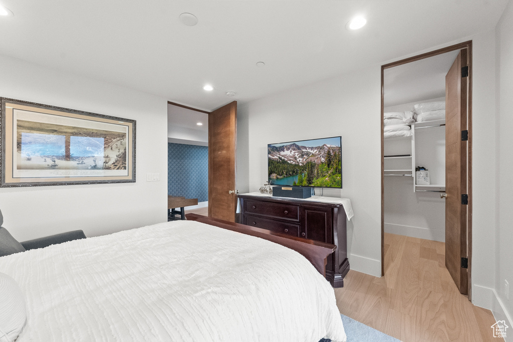 Bedroom featuring light hardwood / wood-style flooring and a closet